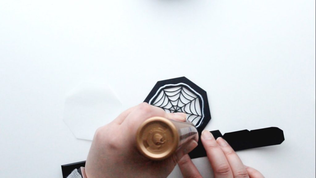 apply glue to the inside edge of the spider web lid border