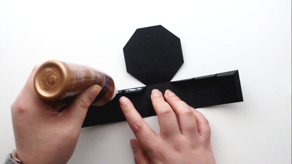 apply glue to the tabs of your treat box base